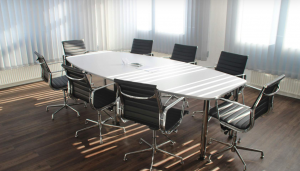 empty meeting room with chairs around a table